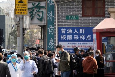 China's daily cases of symptomatic COVID more than triple