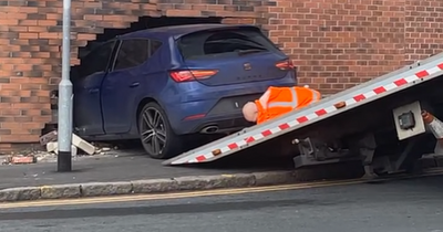 Leeds driver wedges car in wall in horror smash then climbs out of the boot unhurt