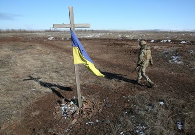 Russia strikes near Polish border as Mariupol counts its dead