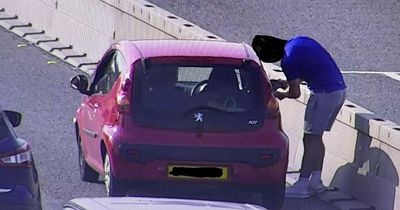 Moment driver got out of his car in middle of M6 to adjust his wing mirror