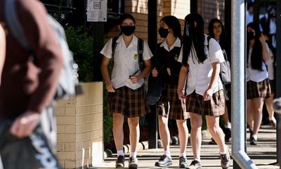 NSW school returns to remote learning as spiralling Covid cases hit classrooms