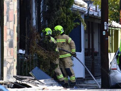 Suspicious boarding house fire kills three