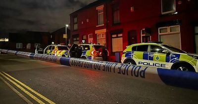 Man stabbed to death and woman rushed to hospital with 'multiple stab wounds'