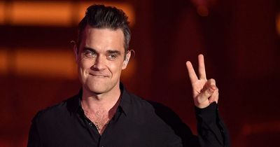 Robbie Williams thinking of wearing a wig on tour following failed hair transplant
