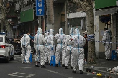 Hazmat suits and panic buying: pandemic images return to China