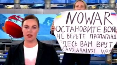 ‘No war’: Russian state TV producer interrupts newscast in daring act of dissent