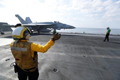 U.S. carrier displays air power over Yellow Sea as N.Korea seen set to test long-range missile