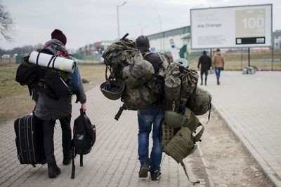 Foreign fighters in Ukraine await weapons in chaos of war