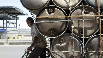 Crude falls below $100, eases pressure on oil companies