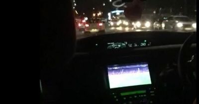 Taxi driver filmed watching football match while driving Nottingham passenger