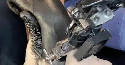 Woman endured 'high level of pain' after getting black tattoo covering whole arm