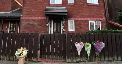 Flowers left at flat fire scene as touching tributes paid to 'auntie Ella'