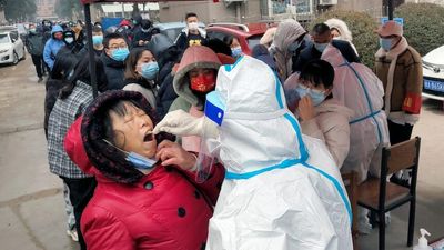 Millions under lockdown in China as COVID-19 cases surge, officials urge over-60s to get vaccinated