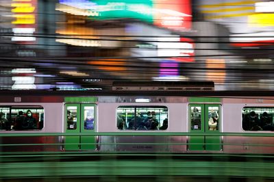 Japan says it will remove more COVID curbs as infections ebb