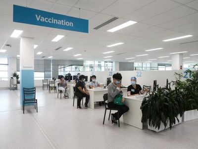 Vaccine target nears as COVID cases surge