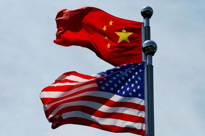 Justice Department accuses China of spying on, intimidating dissidents living in U.S