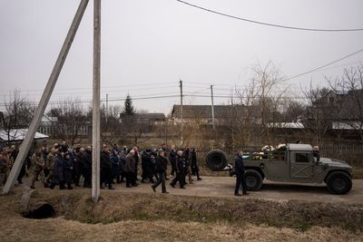 Near Ukraine's border with Poland, a fighting village mourns
