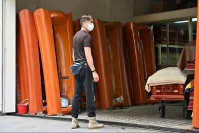 Hong Kong set to run out of coffins within days amid catastrophic Covid surge