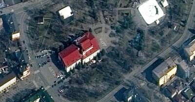 Desperate Ukrainians scrawl 'children' outside theatre before Russians bomb it