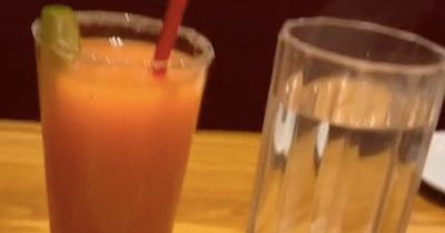 Woman orders a glass of hot water with every meal out and people are confused