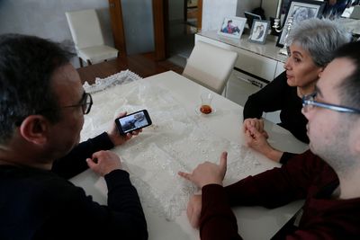 After fleeing Kyiv, Turkish father and son try to leave trauma behind