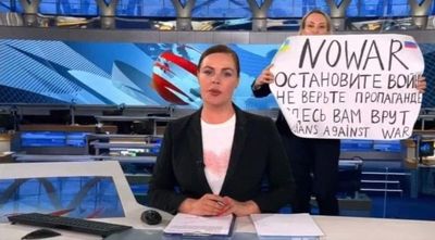 Russian journalists are quitting state-run media after editor flashed anti-war sign live on air