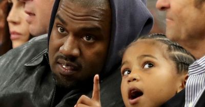 Kanye West breaks cover after Instagram ban to take son Saint to basketball game
