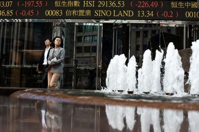 Asian traders take breather, Hong Kong slips after huge surge