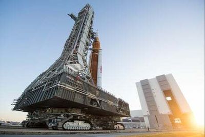 Nasa’s moon rocket begins journey to launch pad