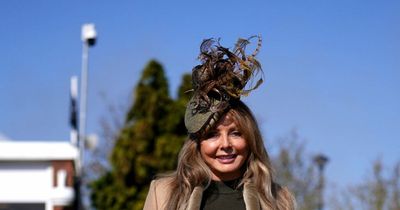 Carol Vorderman arrives at Cheltenham Festival in a stunning leather and feather ensemble