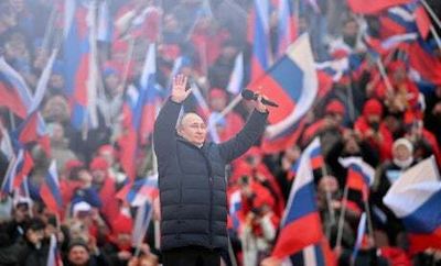 Vladimir Putin cut off mid-sentence during huge rally in Moscow