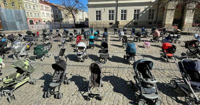 109 empty prams placed in square to mark each child slaughtered by Putin's forces