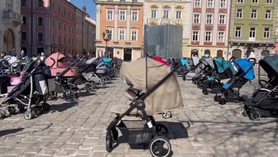 Ukraine: Activists line up 109 empty prams to commemorate children killed during Russia’s war