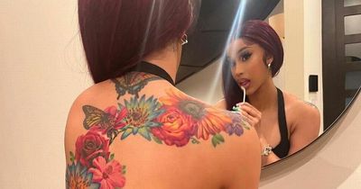 Cardi B shows off 'work of art' back tattoo after teasing rare snap of baby son