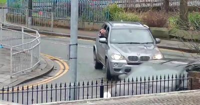 Shocking footage shows gunman shooting at rival and almost killing innocent driver