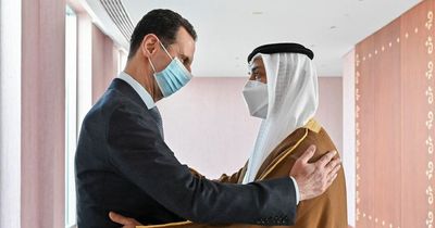 Man City boss sparks fury as he's pictured hugging Syria's mass-murdering tyrant Assad