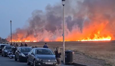 Fire crews tackle blaze on marshland on the Wirral