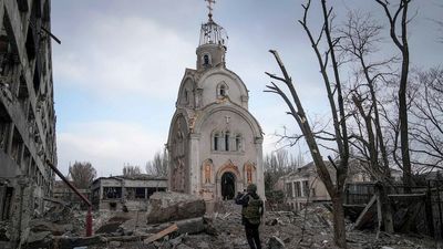Satellite images reveal extent of damage to Mariupol theatre, as displaced families tell harrowing stories of escape