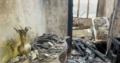 Abandoned hotel gutted by fire that killed owner's wife is like 'world without humans'