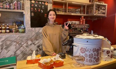 ‘I’d rather die here’: coffee, flowers and defiance on the streets of Kyiv