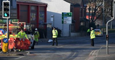 Two men in serious condition after BMW smashes into building in police chase