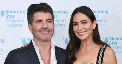 Simon Cowell rides his bike without a helmet despite breaking his back in cycle crash