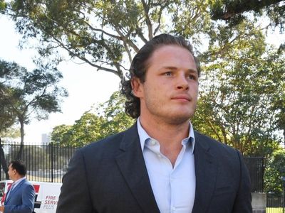Burgess named in squad despite charge
