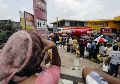 Crisis-hit Sri Lanka sends troops to fuel stations, aims to restructure debt