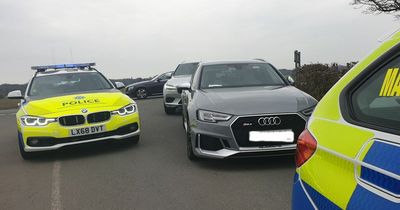 Disqualified driver crashes £60k Audi into car and bush after fleeing police