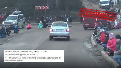 This video showing Ukrainians kneeling as a convoy passes was filmed before the current war