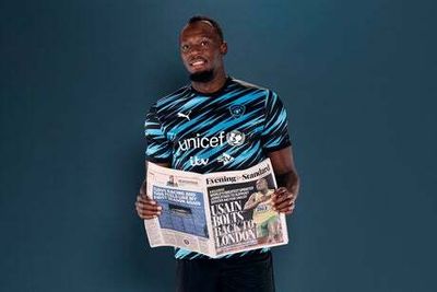 Usain Bolt poses with Evening Standard as London venue for Soccer Aid is revealed