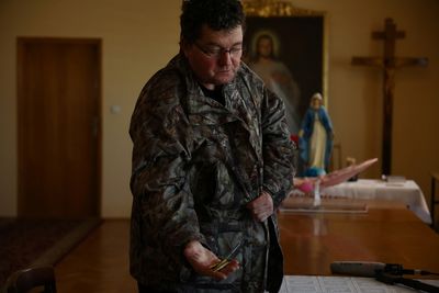 Polish priest prays for peace as he takes in 24 Ukrainian refugees