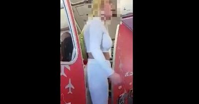 Moment 'out of control' woman forced Jet2 Manchester flight to divert - before armed police escort her away