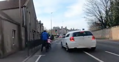 Edinburgh BMW driver narrowly avoids colliding with child in alarming footage